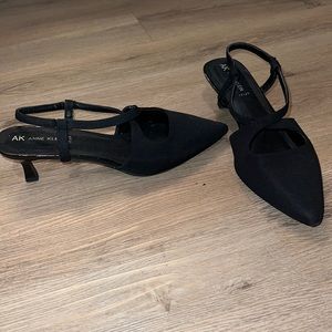 Anne Klein cat heals black